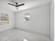 Bright bedroom with ceiling fan and tile floor at 3235 Yorktown St, Sarasota, FL 34231