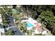 Aerial view of community pool and tennis courts at 3705 E Bay Dr # 212, Holmes Beach, FL 34217