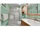 Bathroom with shower, vanity, and wood cabinet at 3705 E Bay Dr # 212, Holmes Beach, FL 34217