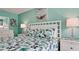 Cozy bedroom with a queen-size bed and calming decor at 3705 E Bay Dr # 212, Holmes Beach, FL 34217