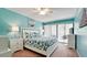Spacious bedroom with a king-size bed and water view at 3705 E Bay Dr # 212, Holmes Beach, FL 34217