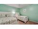 Guest bedroom with twin beds and coastal decor at 3705 E Bay Dr # 212, Holmes Beach, FL 34217