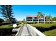 Building exterior showcasing walkway to waterfront at 3705 E Bay Dr # 212, Holmes Beach, FL 34217