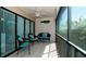 Bright lanai featuring comfortable seating and ceiling fan at 3705 E Bay Dr # 212, Holmes Beach, FL 34217