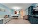 Living room with sectional sofa and view into dining area at 3705 E Bay Dr # 212, Holmes Beach, FL 34217