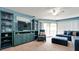 Living area with sectional sofa, TV, and built-ins at 3705 E Bay Dr # 212, Holmes Beach, FL 34217