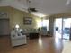 Living room with hardwood floors and access to a patio at 3920 Douglas Hill Pl, Parrish, FL 34219