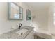 Updated bathroom features granite countertop, updated vanity, and a shower/tub combo at 5120 33Rd E St, Bradenton, FL 34203