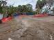Cleared lot ready for new construction, surrounded by lush tropical landscaping at 5174 Sandy Cove Ave, Sarasota, FL 34242