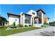 Modern two-story home with attached garage and landscaped yard at 5174 Sandy Cove Ave, Sarasota, FL 34242