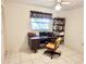 Home office with desk, chair, and built-in shelving at 5277 San Luis Ter, North Port, FL 34286