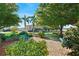 Landscaped community entrance with benches and paved walkway at 5407 Bali Ct, Bradenton, FL 34207