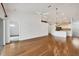 Open living room with hardwood floors, kitchen island, and a chandelier at 5412 Stoneybrook Ln, Bradenton, FL 34203