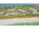 Luxury beachfront condominium complex with golf course, pool, beach access, and lush tropical landscape at 545 Sanctuary Dr # B406, Longboat Key, FL 34228