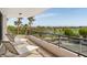 Balcony with lounge chairs and golf course views at 545 Sanctuary Dr # B406, Longboat Key, FL 34228
