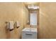 Powder room with floral wallpaper, a white vanity, and a large mirror at 545 Sanctuary Dr # B406, Longboat Key, FL 34228