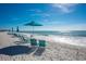 Beach with lounge chairs and umbrellas at 545 Sanctuary Dr # B406, Longboat Key, FL 34228