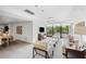 Community room lounge area with comfortable seating and large windows at 545 Sanctuary Dr # B406, Longboat Key, FL 34228