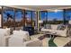 Inviting living room with large windows showcasing stunning evening views at 545 Sanctuary Dr # B406, Longboat Key, FL 34228