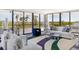 Bright, open living room with large windows showcasing stunning views and stylish furniture at 545 Sanctuary Dr # B406, Longboat Key, FL 34228