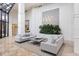 Elegant lobby with high ceilings, natural light, plush seating, and modern decor at 545 Sanctuary Dr # B406, Longboat Key, FL 34228
