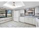 Kitchen features white appliances and a window overlooking the backyard at 5569 Boulder Blvd, Sarasota, FL 34233