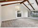 Living room with vaulted ceiling, exposed beams, and chandelier at 5569 Boulder Blvd, Sarasota, FL 34233