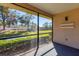 Screened-in porch overlooking a tranquil pond at 5569 Boulder Blvd, Sarasota, FL 34233