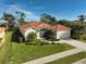 Aerial view of single-Gathering home with driveway and landscaping at 567 Laurel Cherry Ln, Venice, FL 34293