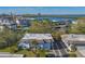 Community aerial view highlighting buildings, parking, and nearby water at 575 Sutton Pl # T-4, Longboat Key, FL 34228