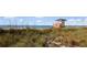 Scenic beach view with lifeguard stand and sea oats at 584 Beverly Rd, Venice, FL 34293
