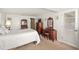 Bedroom with double bed, dresser, and antique vanity at 584 Beverly Rd, Venice, FL 34293