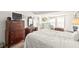 Bedroom featuring a double bed and antique wooden furniture at 584 Beverly Rd, Venice, FL 34293