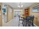 Casual dining area with a round table and chairs, adjacent to the kitchen at 584 Beverly Rd, Venice, FL 34293