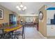 Open dining area with a round table and chairs, flows into the living room at 584 Beverly Rd, Venice, FL 34293