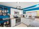 Well-equipped kitchen featuring stainless steel appliances and ample cabinet space at 584 Beverly Rd, Venice, FL 34293