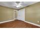 Spacious bedroom with hardwood floors and ceiling fan at 6111 Braden Run, Bradenton, FL 34202