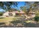 Ranch style home with stone accents and a spacious lawn at 6111 Braden Run, Bradenton, FL 34202