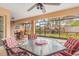 Spacious screened porch with outdoor dining set at 6600 Deering Cir, Sarasota, FL 34240