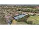 An aerial view showcases the community's four pickleball courts, surrounded by lush landscaping and convenient parking at 7042 Twin Hills Ter, Lakewood Ranch, FL 34202