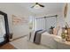 Bright bedroom with barn doors, a comfy bed, and stylish decor at 7042 Twin Hills Ter, Lakewood Ranch, FL 34202