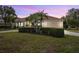 House exterior with manicured lawn and two-car garage at 7042 Twin Hills Ter, Lakewood Ranch, FL 34202