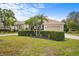 House with a circular driveway and landscaping at 7042 Twin Hills Ter, Lakewood Ranch, FL 34202