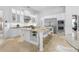 Bright kitchen with an island, white cabinets, stainless appliances, and barstool seating at 7042 Twin Hills Ter, Lakewood Ranch, FL 34202