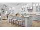 Spacious kitchen island with seating, granite countertops, and modern appliances at 7042 Twin Hills Ter, Lakewood Ranch, FL 34202