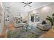 Open-concept living area featuring neutral colors, sliding glass doors, and a tray ceiling at 7042 Twin Hills Ter, Lakewood Ranch, FL 34202