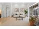 Bright living room with neutral decor, stylish furniture, and access to outdoor space at 7042 Twin Hills Ter, Lakewood Ranch, FL 34202
