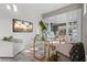 Serene home office with ample natural light, modern desk setup, and a relaxing view at 7042 Twin Hills Ter, Lakewood Ranch, FL 34202