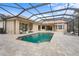 Sparkling pool with screened enclosure, brick paver patio, and comfortable lounging chairs at 7042 Twin Hills Ter, Lakewood Ranch, FL 34202