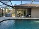Enjoy a beautiful pool with a screened enclosure, perfect for outdoor entertaining and relaxation at 7042 Twin Hills Ter, Lakewood Ranch, FL 34202